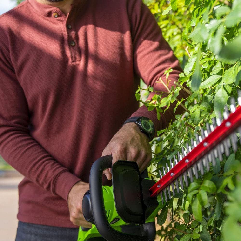 Greenworks hedge trimmer rotating rear handle for reach and control.