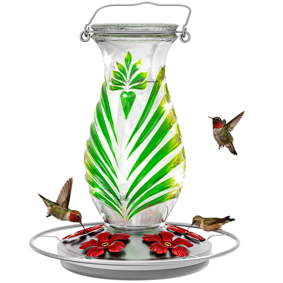 Grete Gotye hummingbird feeder features a glass nectar reservoir with vibrant color for garden charm