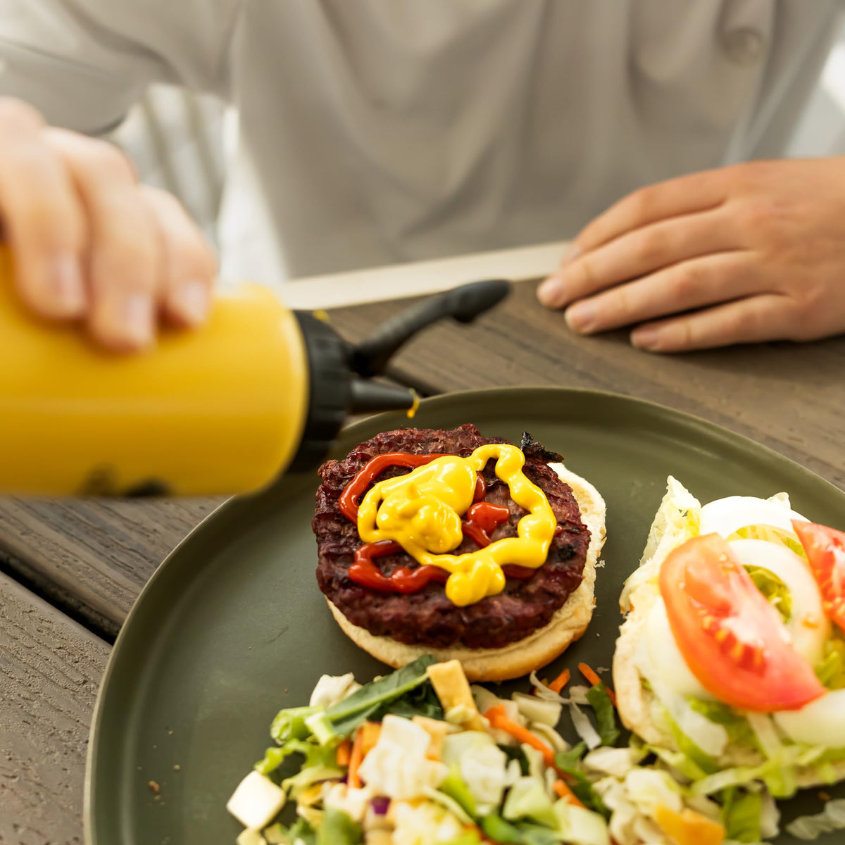 GRiLLiT extra cap for convenient dispensing and secure storage of sauces.