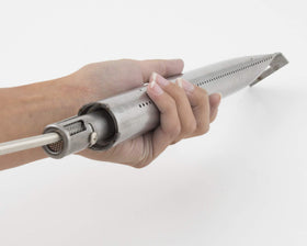 GrillPro maintenance brush with narrow head cleans corners of cookbox and ignition parts.