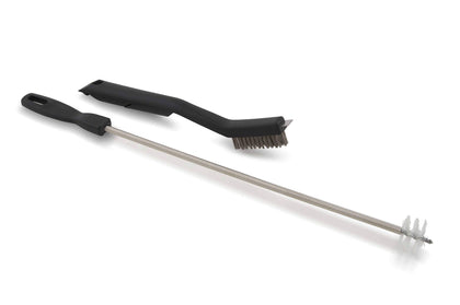 GrillPro venturi brush reaching deep into burners to clear nests for safer airflow.