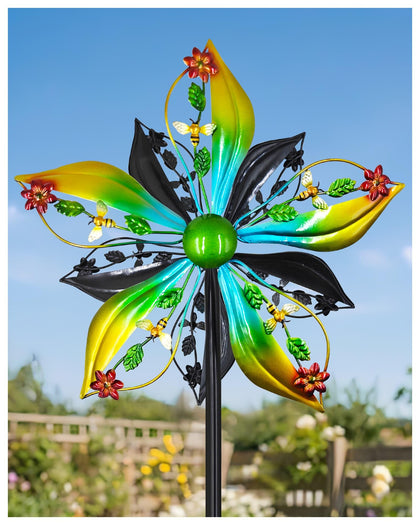 Gronhof wind spinner with dual-sided blades spinning in the breeze for dynamic yard art.