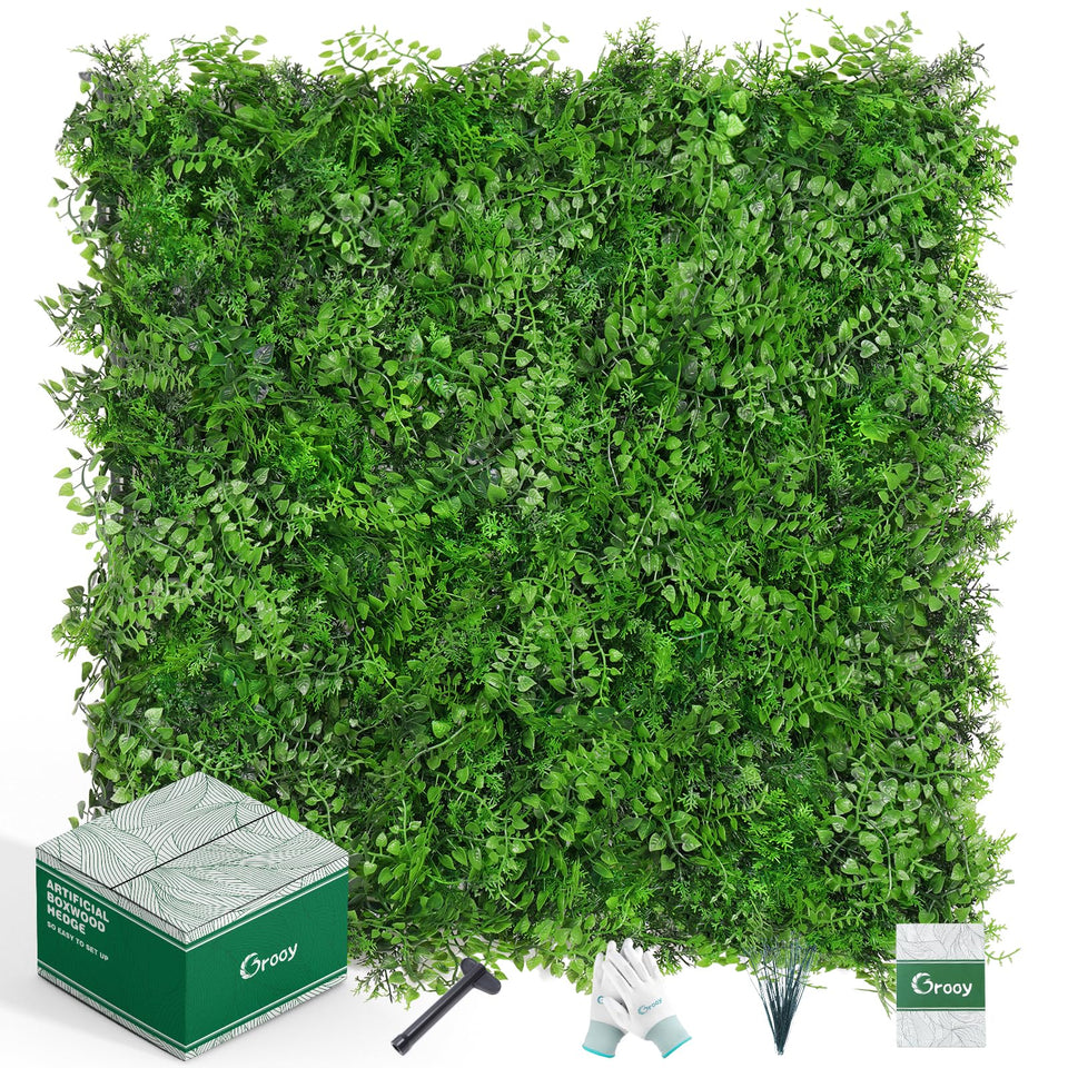 Grooy boxwood hedge wall panels create a lush privacy backdrop.