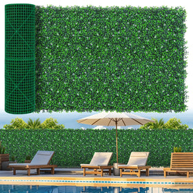 Grooy boxwood roll panel with flowers provides dense outdoor privacy.