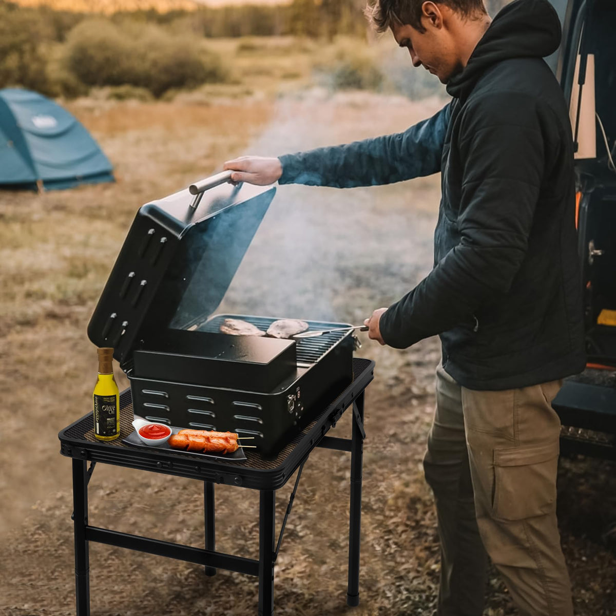 Grovind height adjustable grill table adapts to seated or standing use.
