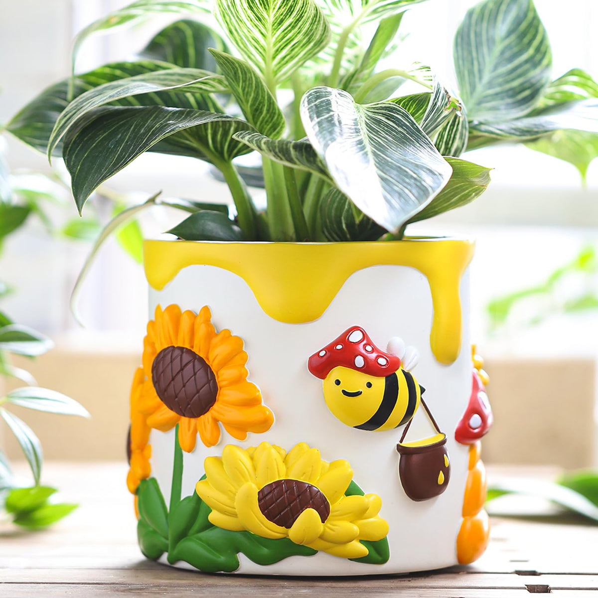GUGUGO color-bees-sunflowers pot on windowsill showing vibrant indoor garden scene