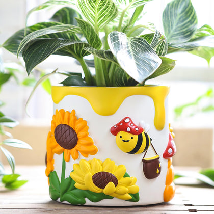 GUGUGO color-bees-sunflowers pot on windowsill showing vibrant indoor garden scene