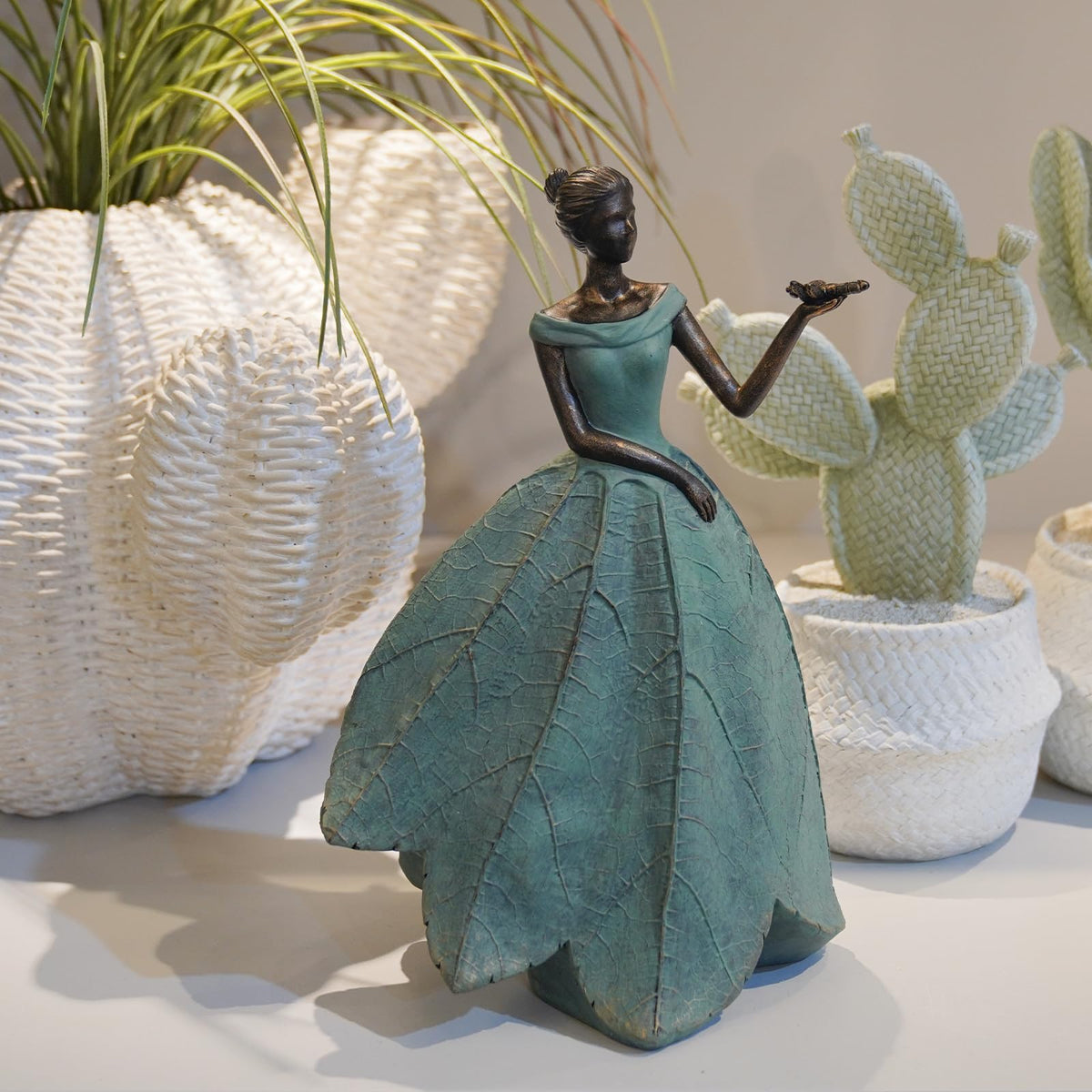 Guichifun Fairy Statue with leaf-angel and lily creates a graceful garden focal point.