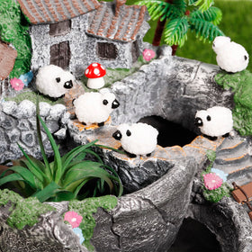 Guiqulai resin sheep withstands temperature changes for lasting garden art.