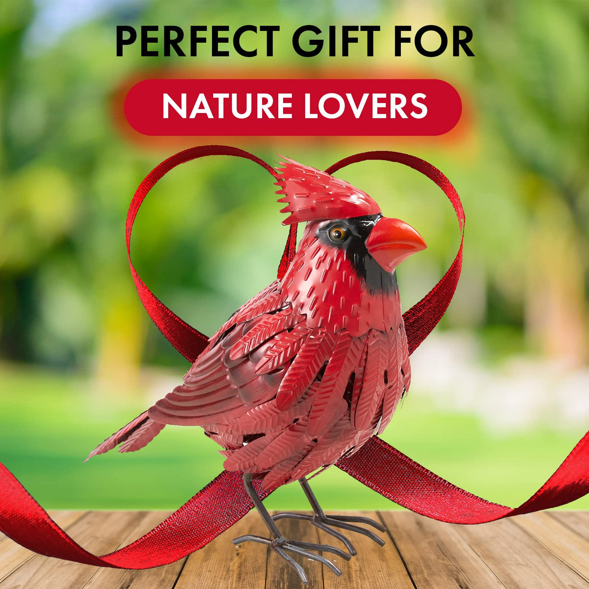 GUTE Cardinal decor attached to a tree branch in a yard