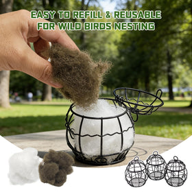 Gute rust-resistant nesting ball hanging from a branch