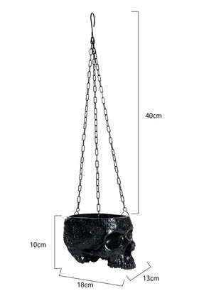 GUTE skull planter suitable for indoor or outdoor display with small plants.