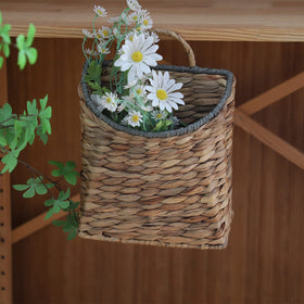 GYASVWU water hyacinth basket with handle ideal for plant or vase display.
