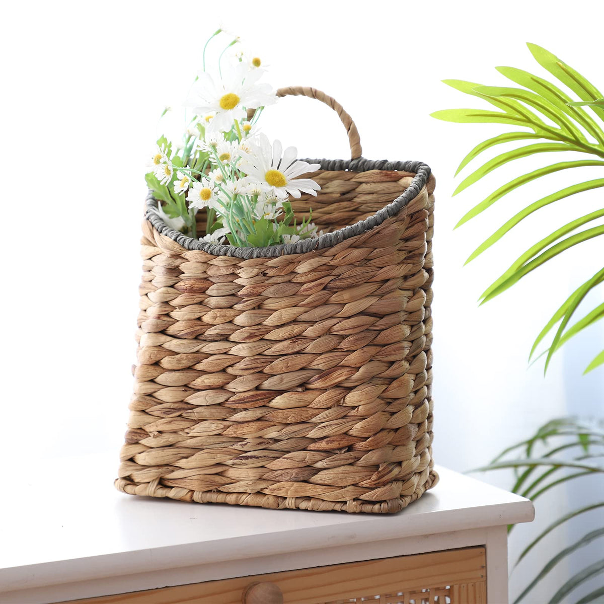 GYASVWU multi-use basket shown with dried flowers or greenery.