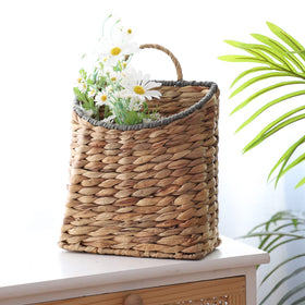 GYASVWU multi-use basket shown with dried flowers or greenery.