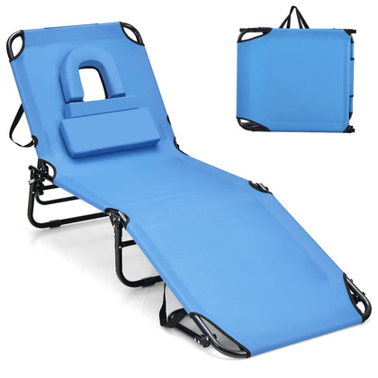GYMAX tanning chair with face hole for comfortable beach sunbathing.