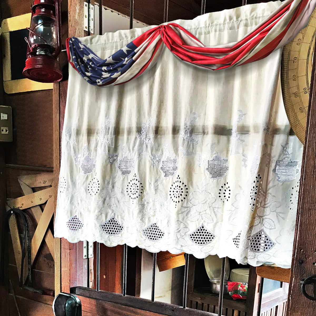 Hahafelt Memorial Day decor draped over railings and pillars.