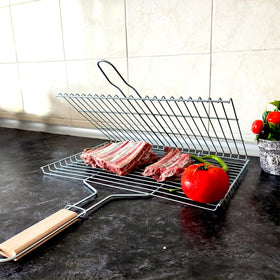 Locking mechanism on Hakan grill basket securing food on grill