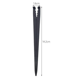 Hanobo drip hose stake installed to anchor 1/4–inch tubing near plant roots