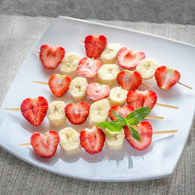 HANSGO catering setup shows party-ready skewers for appetizers and bites.