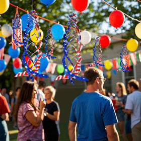 Hausse patriotic bird spinner spins in breeze, adding color to garden.