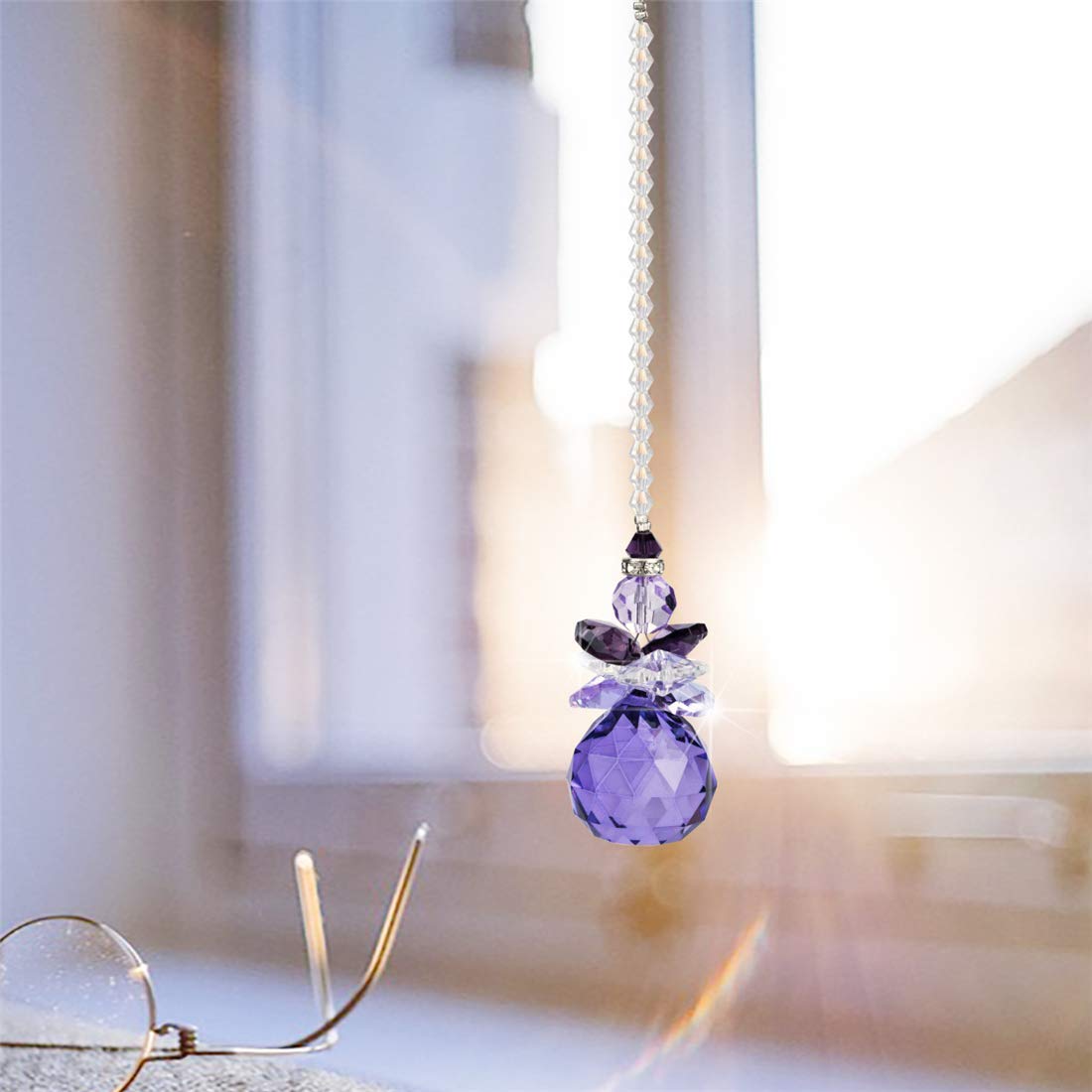 H&D crystal angel sun catcher for car windows creates rainbow sparkles on the go.