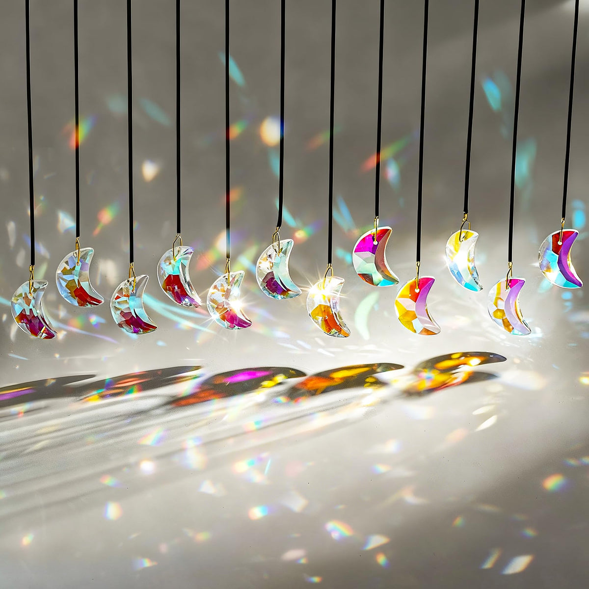 H&D HYALINE & DORA crystal suncatcher 12pc set creates vivid rainbows in sunny windows.