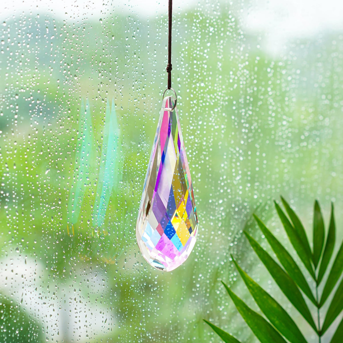 H&D AB-coated crystal suncatcher reflects sun into lively rainbows.