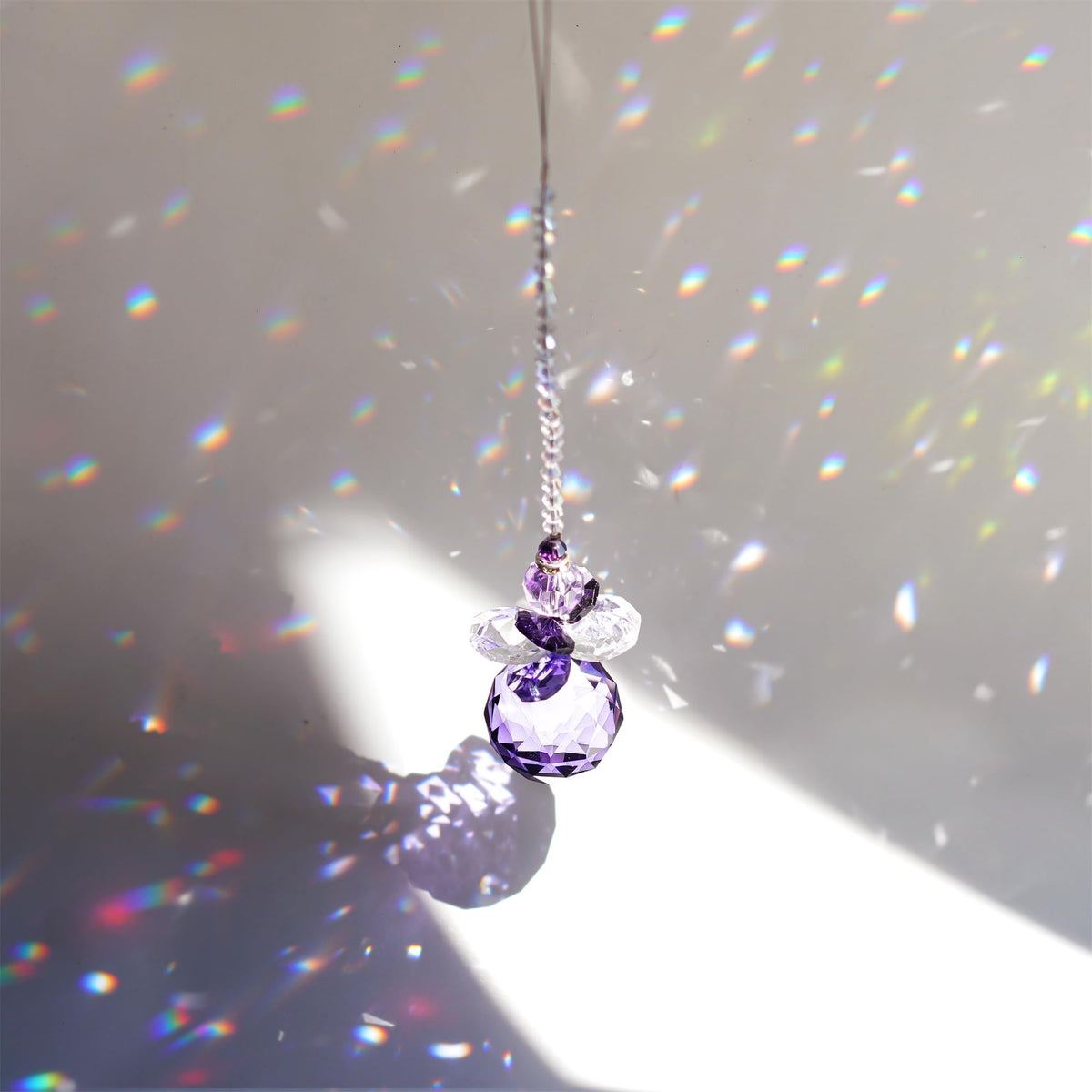 H&D feng shui crystal angel pendant brightens spaces with rainbow reflections.