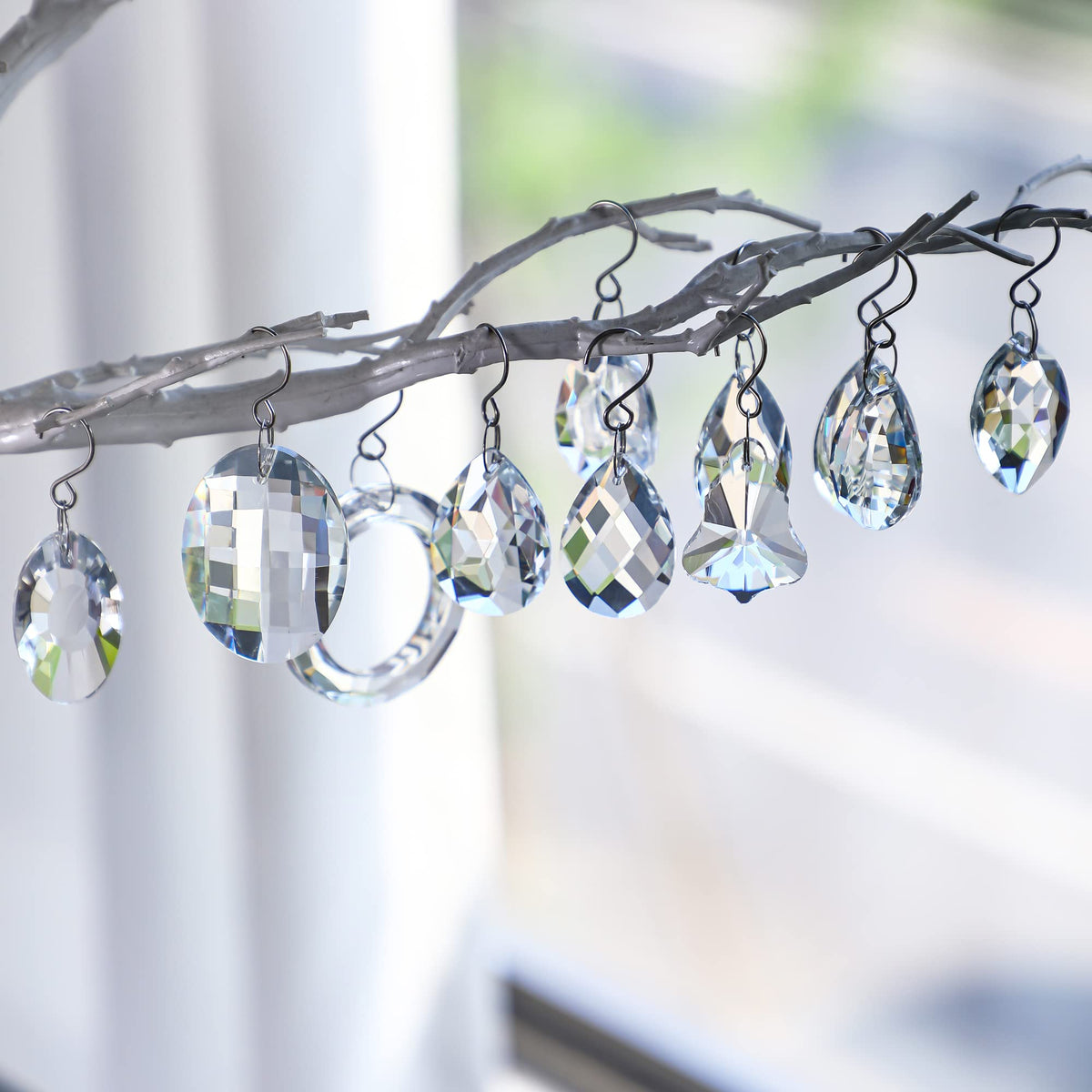 H&D HYALINE & DORA clear crystal pendant close-up showing facets for sparkle