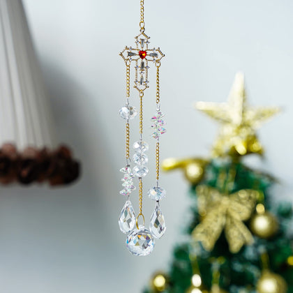 H&D HYALINE & DORA cross suncatcher creates rainbow prisms in sunlight