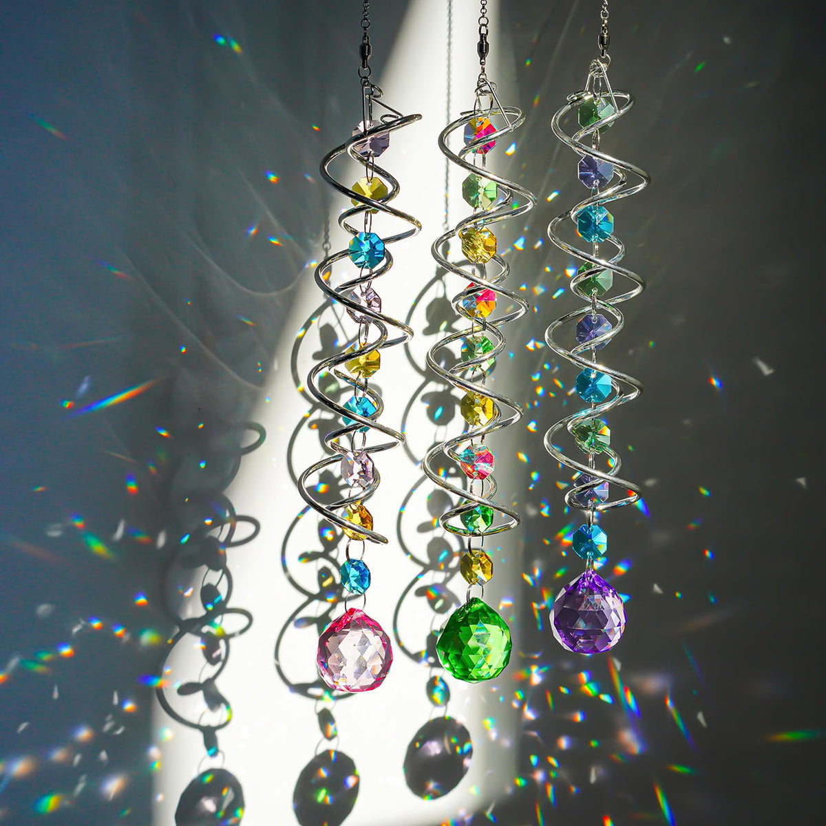 HD Hyaline & Dora crystal ball and octagon crystals reflect sunbeams across surfaces