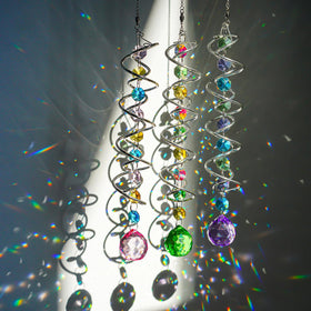 HD Hyaline & Dora crystal ball and octagon crystals reflect sunbeams across surfaces