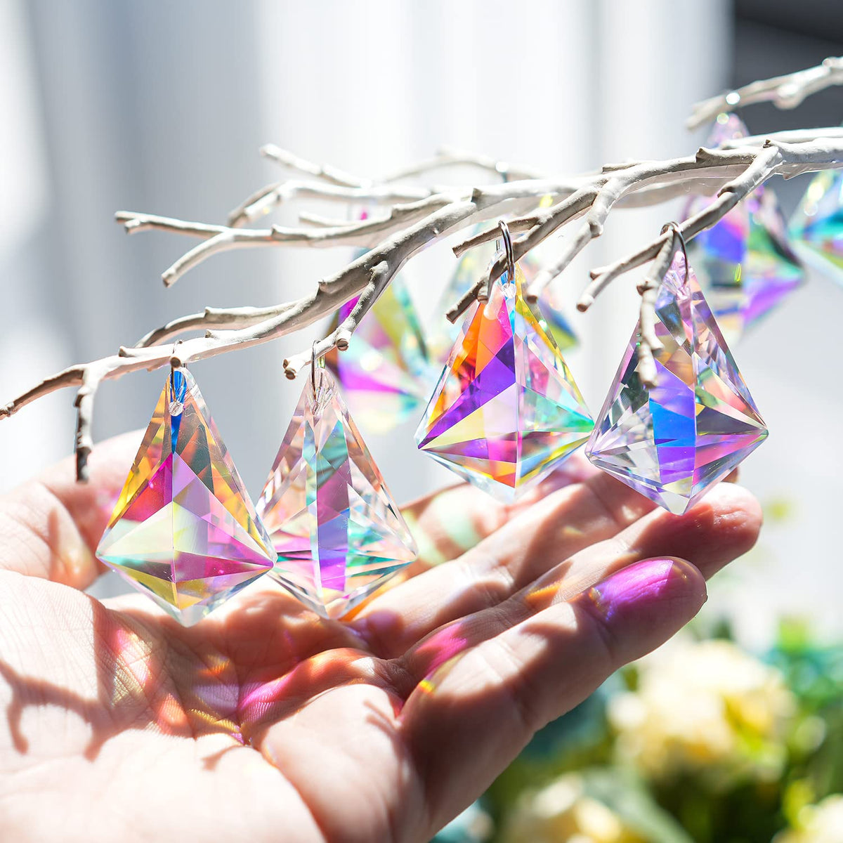H and D Hyaline and Dora hanging crystal pendants brighten a chandelier with shimmering facets