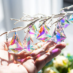 H and D Hyaline and Dora hanging crystal pendants brighten a chandelier with shimmering facets