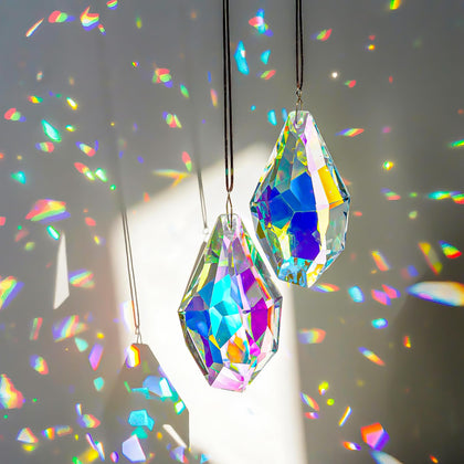 H&D Hyaline & Dora crystal sun catcher prisms viewed in sunlight, creating colorful rainbows.