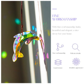 H&D Hyaline & Dora AB-coated dolphin sun catcher decorates a Christmas tree.