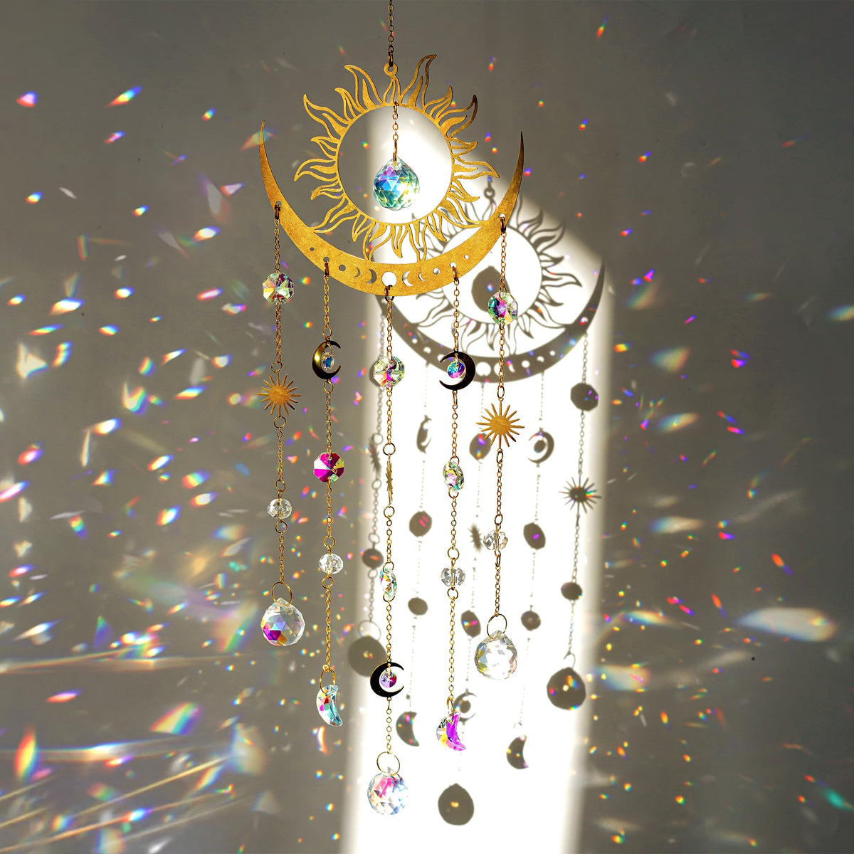 H&D Hyaline & Dora sun-moon suncatcher prisms casting vibrant rainbows in a sunny window