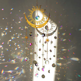 H&D Hyaline & Dora sun-moon suncatcher prisms casting vibrant rainbows in a sunny window