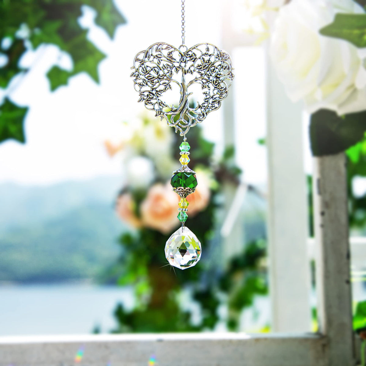 H&D Hyaline & Dora tree of life crystal ornament catches sunlight for shimmering reflections