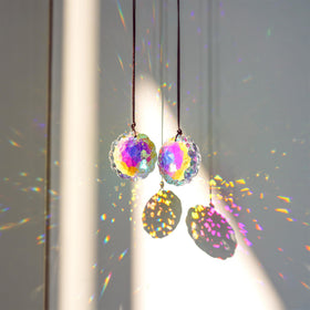 HDCRYSTALGIFTS Datura suncatcher close-up reveals clear crystal facets.