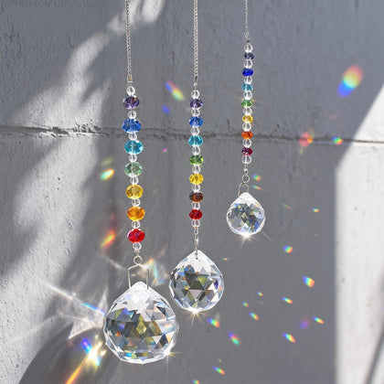 HDCRYSTALGIFTS crystal prisms suncatchers casting rainbow reflections in a sunny window