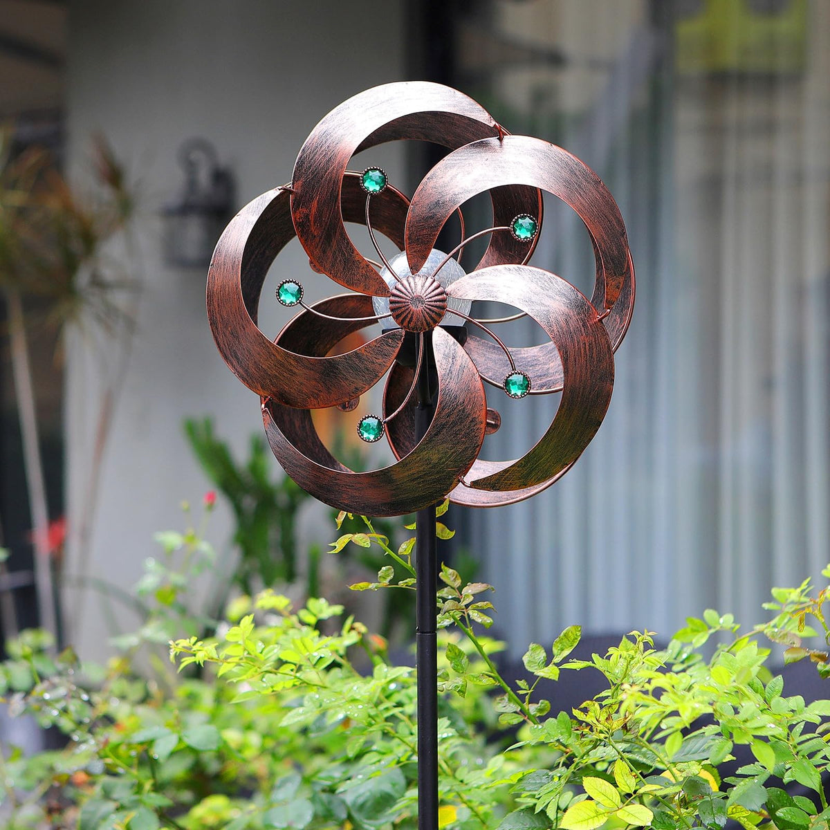 HDNICEZM Solar Wind Spinner with glass ball displays jewel tones in breeze for outdoor appeal.
