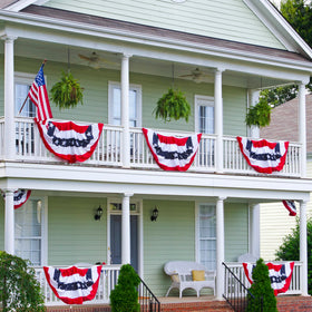 Heartome US flag banners add festive charm to garden borders.