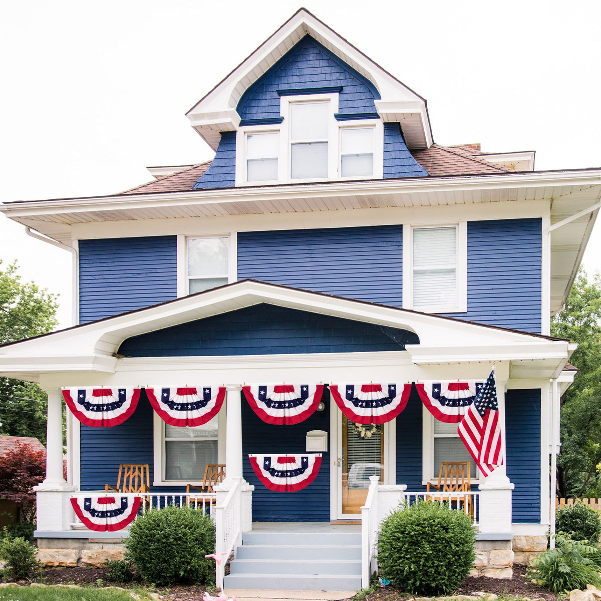 Heartome Memorial Day banner shown on a balcony with festive flair.
