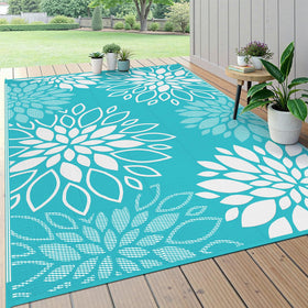 HEBE floral reversible outdoor rug on patio adds color and comfort