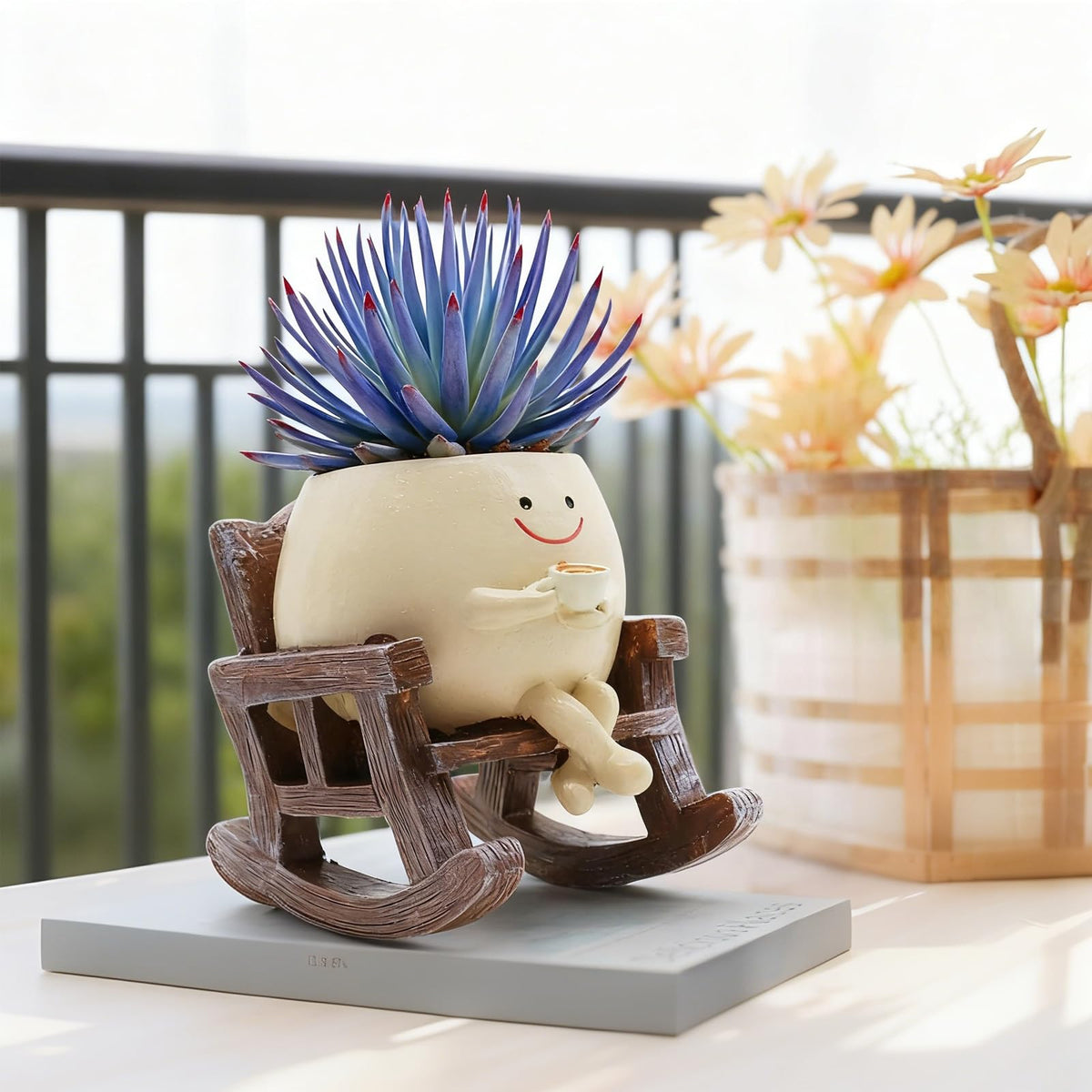 Heuvcnsr resin smiley pot rocking-chair, coffee cup detail adds whimsy to balconies.