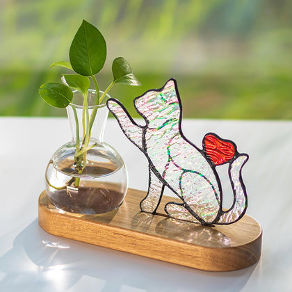 Hewory iridescent stained-glass cat planter on desk with colorful reflections