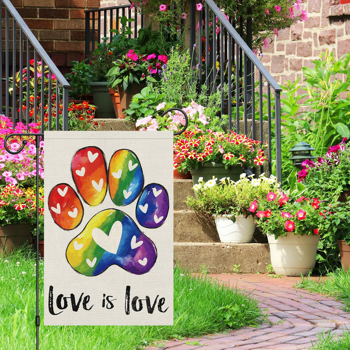 Heyfibro rainbow-footprints Pride flag visible on both sides for vibrant yard decor.