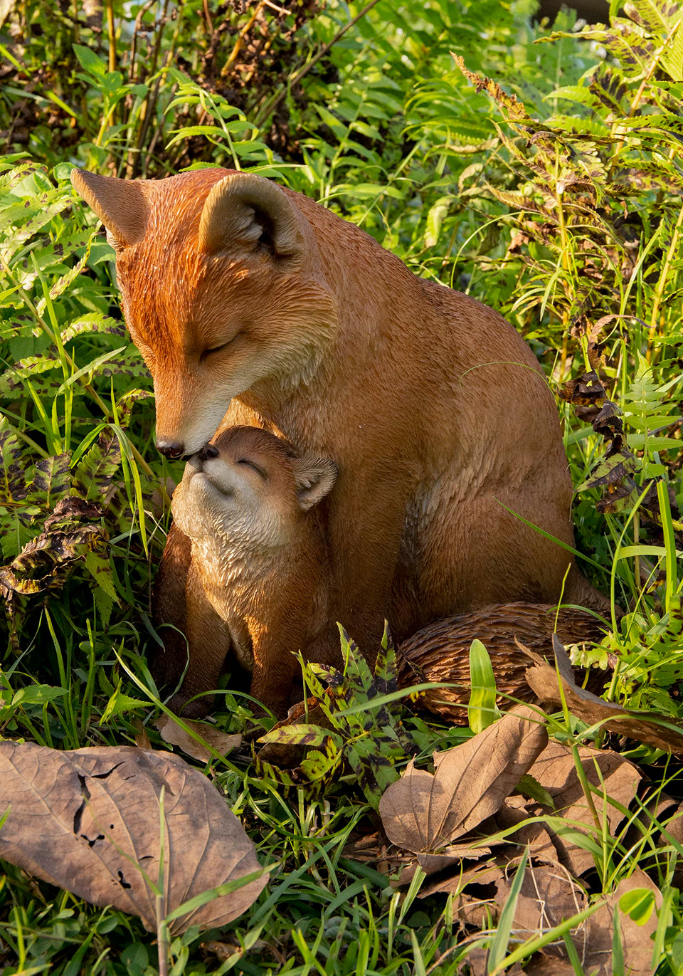 Hi-Line mother and baby fox garden statue in brown adds warmth to outdoor spaces.